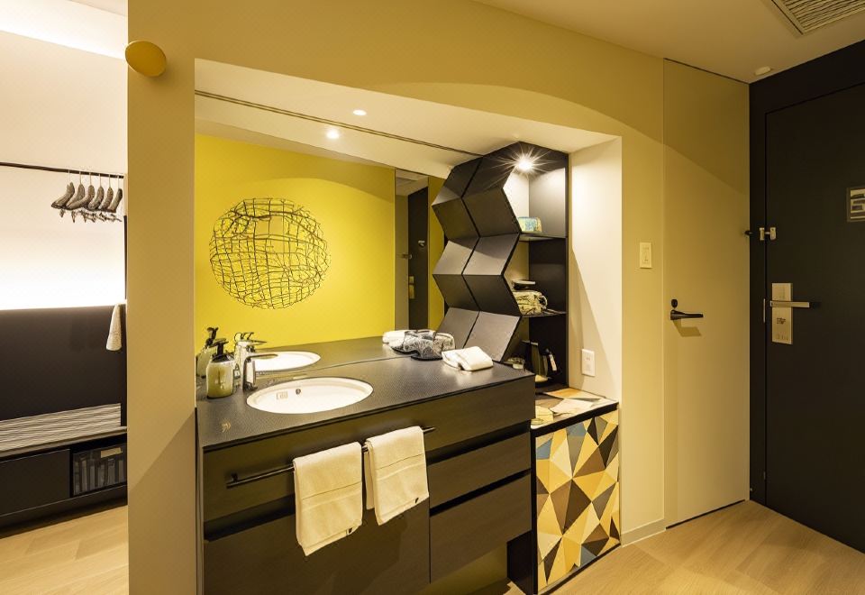 Where to Stay in Osaka 2026: 6 Best Areas + 12 Hotels Osaka Excel Hotel Tokyu guest-room entrance and washbasin area