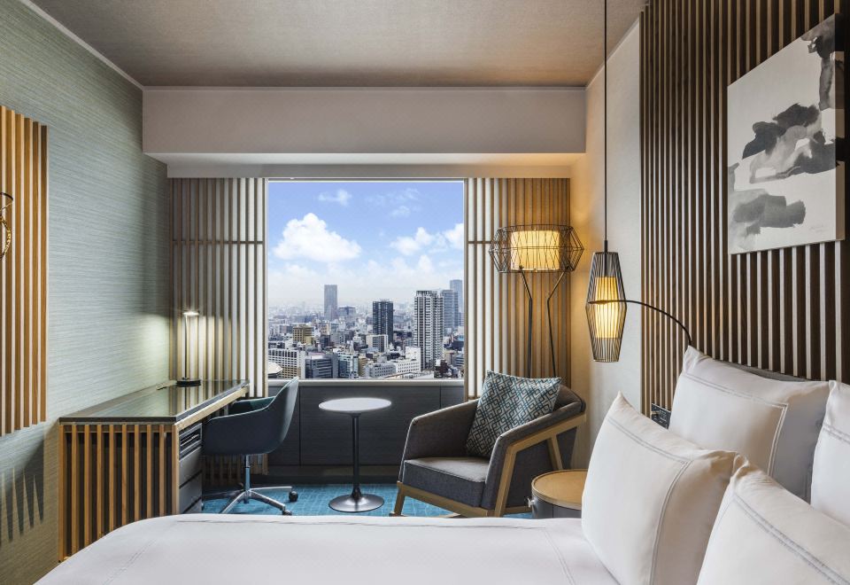 Where to Stay in Osaka 2026: 6 Best Areas + 12 Hotels Swissôtel Nankai Osaka guest room with seating area and Osaka city view